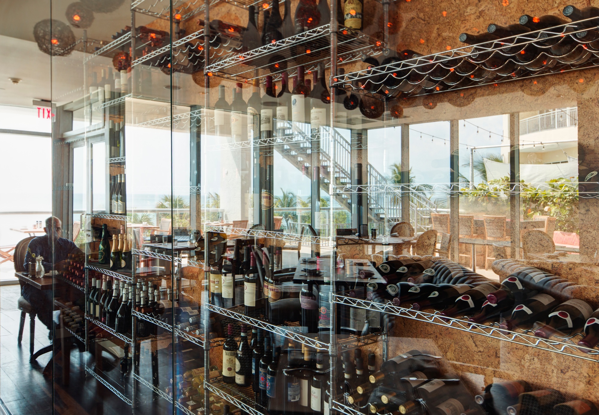 Wine bottles on shelves in restaurant